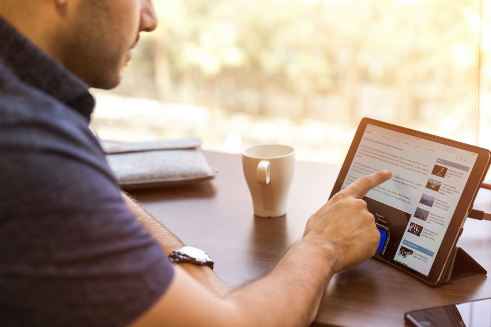 Reading a long-form analytical report on a laptop